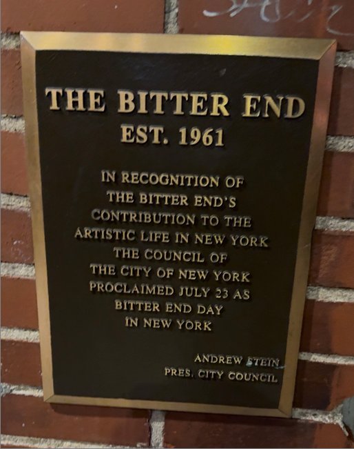 Historic plaque outside The Bitter End recognising its contribution to the artistic life of New York City