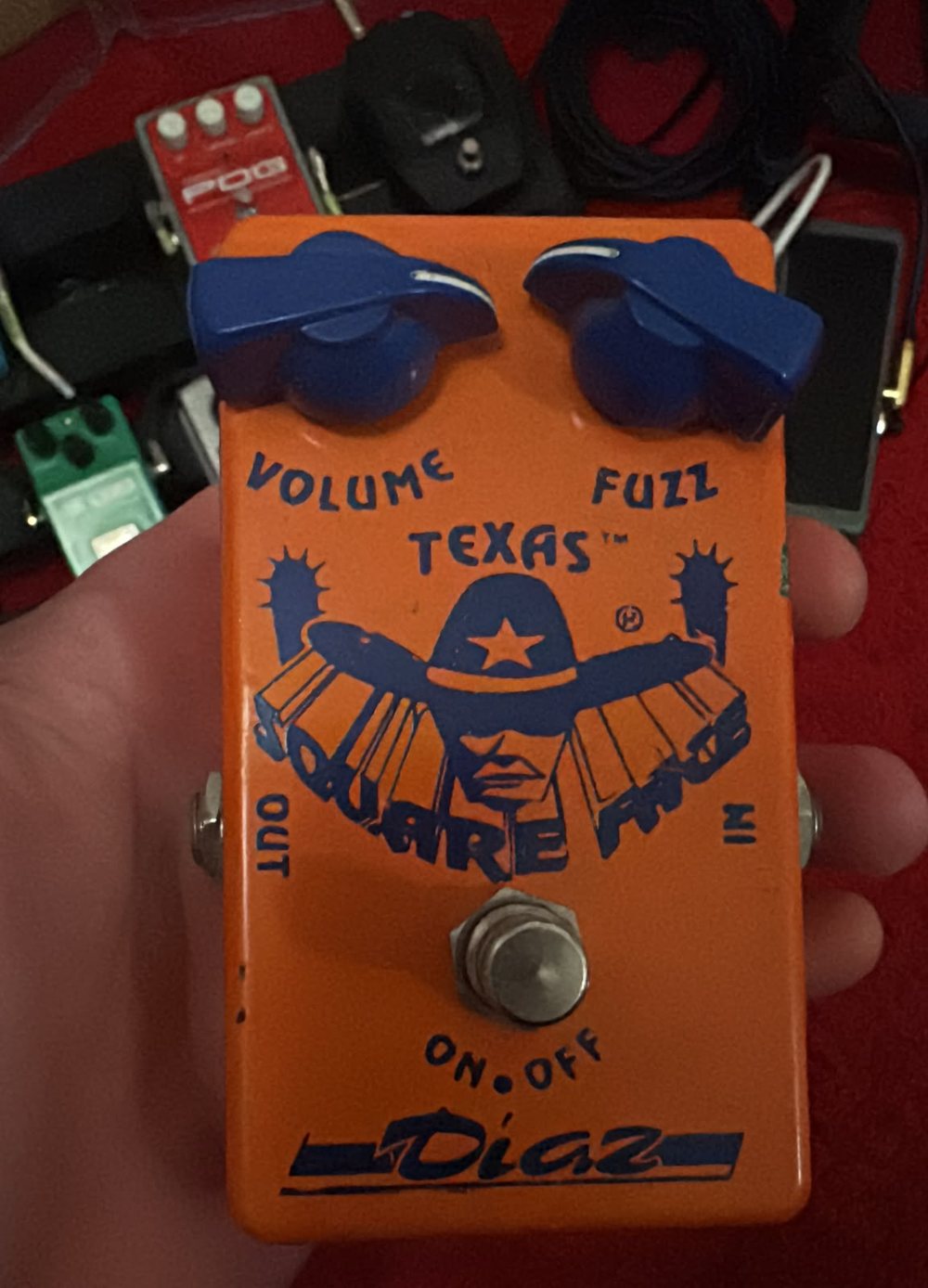 Gerbman's own Diaz Texas Square Face Fuzz, orange enclosure with blue chicken-head knobs