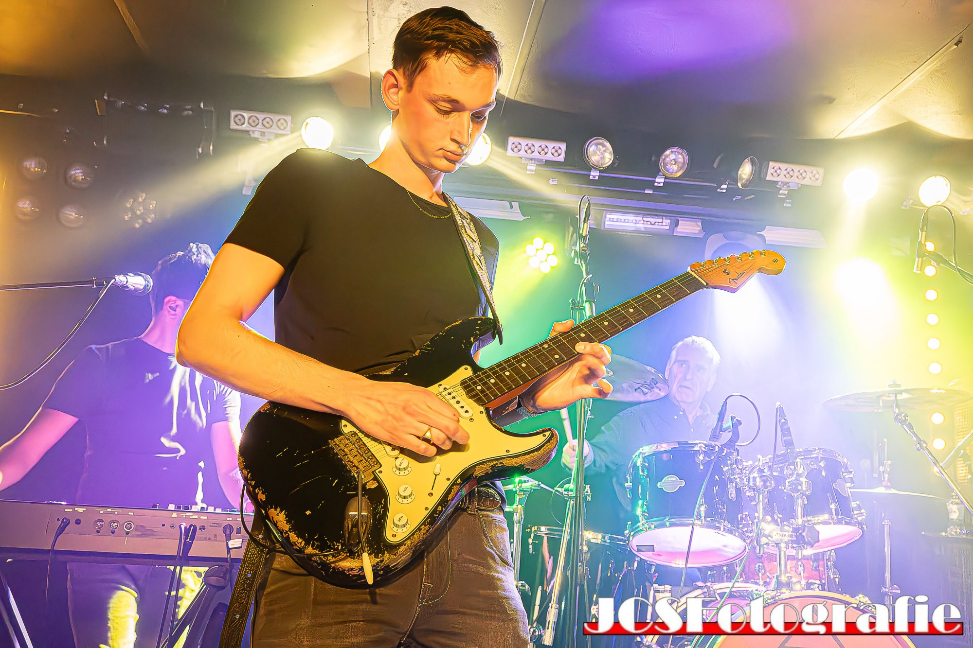 Gerbman & Blues Flood live — full band on stage, Gerbman on black relic Strat with bassist and drummer