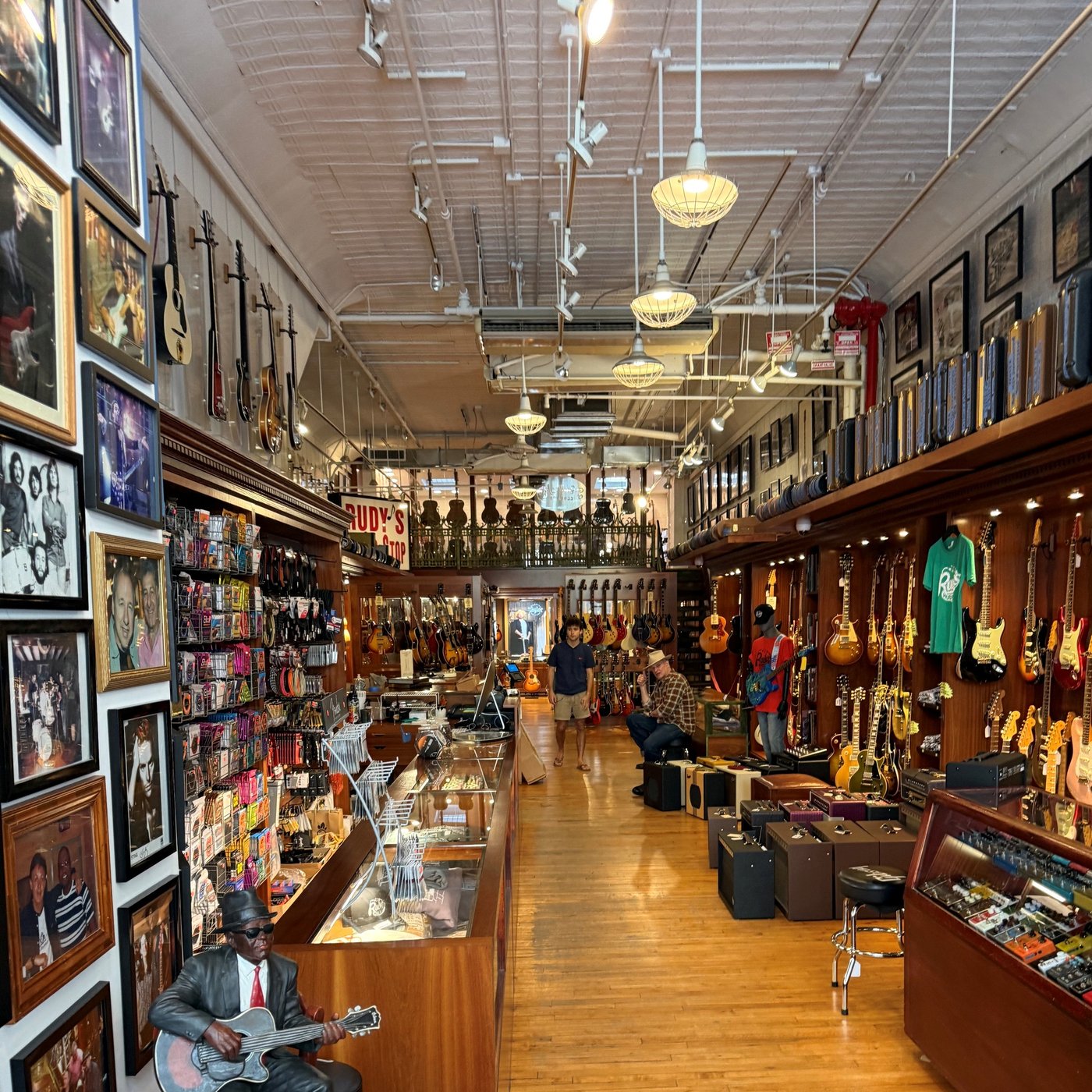 Interior of Rudy&rsquo;s Music in SoHo with guitars and amps displayed throughout the store